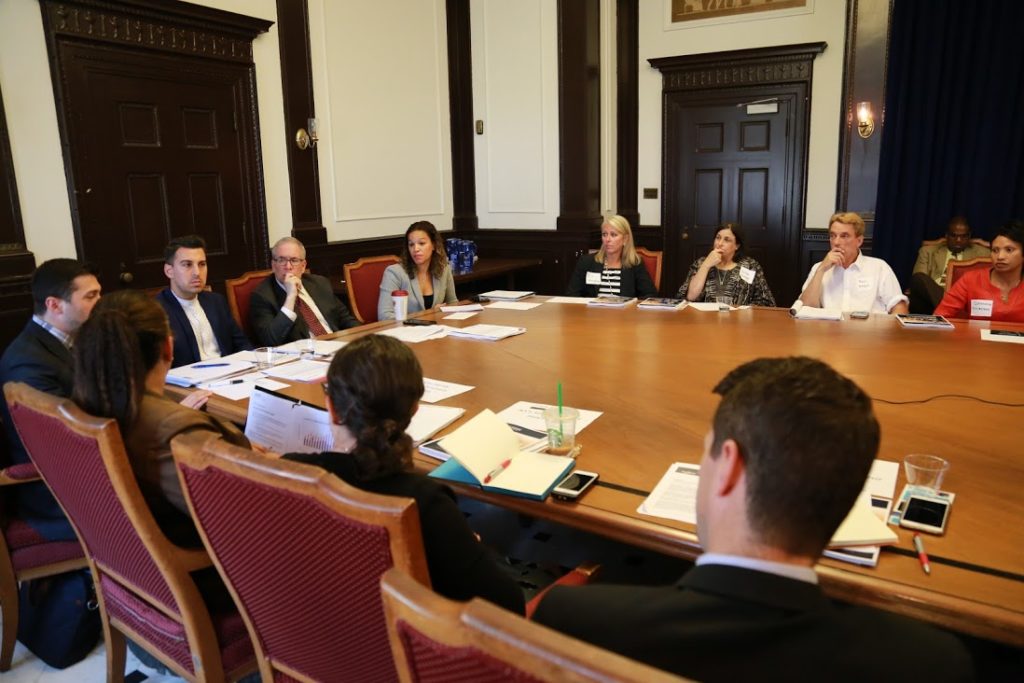 Group of people having a meeting at a large conference desk