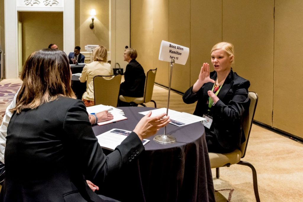 A USBLN Rising Leader interviews with a representative from Booz Allen Hamilton.