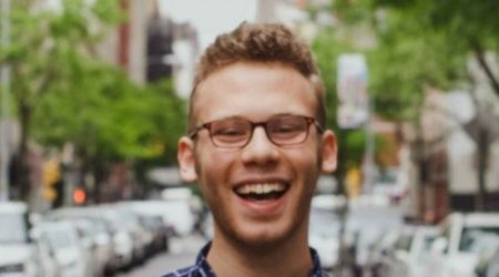 Photo of Bryan Stromer standing in a city street and smiling